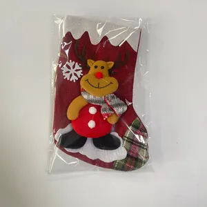 Detail of Christmas stocking with 3D reindeer doll and plaid accents in package