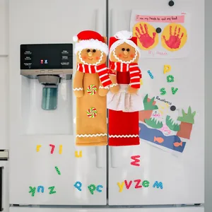 Gingerbread man themed Christmas refrigerator handle covers in a cozy kitchen setting