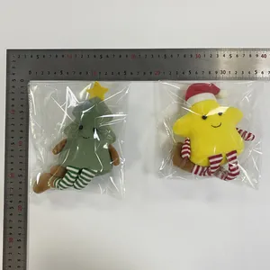 Detailed size display of plush Christmas tree and star figurines with striped legs