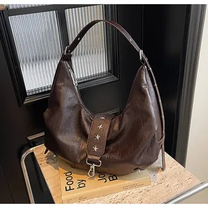 Detailed macro view of retro brown faux leather texture with star studs and silver buckle