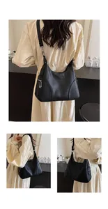 Detailed views of black lychee grain crescent bag with silver zipper and adjustable strap
