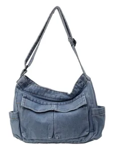 Vintage blue denim crossbody bag with multiple pockets and adjustable shoulder strap