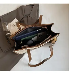 Top view of large tote bag showing spacious interior with laptop and daily essentials