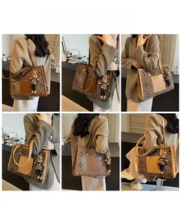 Detailed shots of women's tote bag with vintage monogram pattern and bear pendant charm