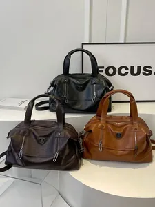 Large soft leather tote bags in black and brown with twin zippers and shoulder straps