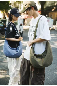 Detailed view of durable nylon dumpling messenger bags in blue and olive green colors