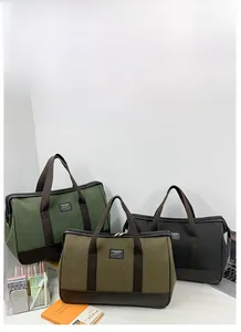 Detailed comparison of large canvas travel bags in dark green, khaki and black colors