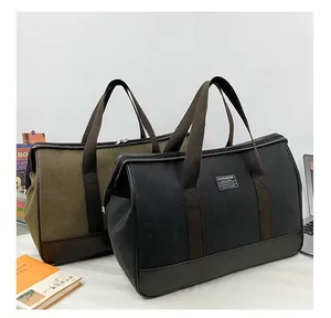 Close-up of durable canvas travel bags with leather base and sturdy carry handles