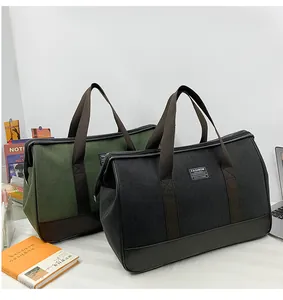Large canvas travel bags in black and olive green with durable brown reinforced base