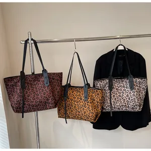 Detailed comparison of three leopard print tote bags in brown, tan, and grey patterns