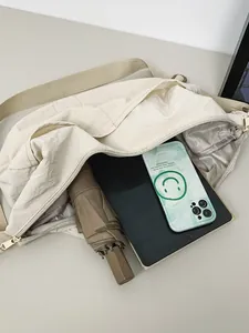 Minimalist waterproof nylon dumpling bag showing large capacity for daily essentials