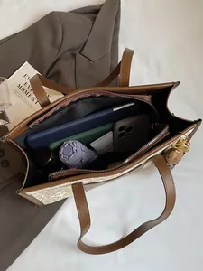 Large vintage tote bag with leather trim showing spacious interior for daily essentials