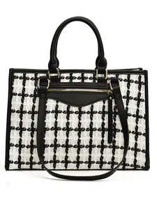Large capacity black and white woven tote bag with faux leather trim and gold zippers