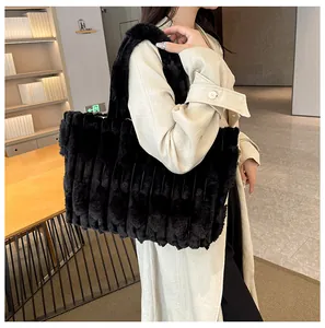 Close-up of black faux fur tote bag showing plush striped texture and soft material