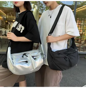 Detailed view of trendy nylon crossbody bags in metallic silver and classic black finishes