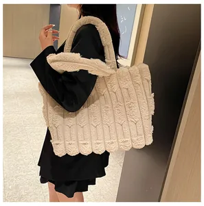 Close-up of cream faux fur tote bag showing plush texture and vertical stripe pattern