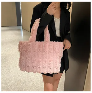 Detail of pink plush tote bag showing soft long-fur texture and vertical stripe pattern