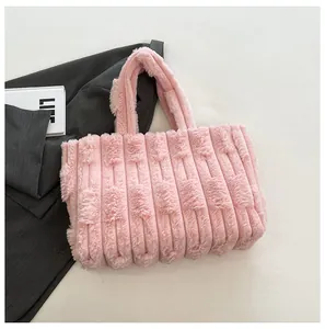 Detailed texture of pink plush tote bag with vertical stripes and soft faux fur handle