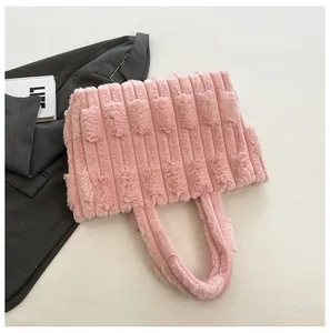 Detail showing plush pink faux fur texture and ribbed pattern on large tote bag