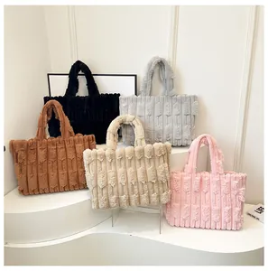 Detailed view of plush tote bags in five colors with soft vertical ribbed texture