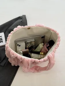 Pink plush tote bag with large capacity showing internal space for tablet and makeup