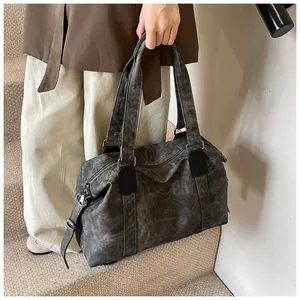Détail du sac cabas vintage en toile lavée gris foncé avec poignées et bandoulière