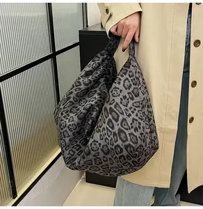Detailed view of oversized leopard print tote bag with soft texture and vintage pattern