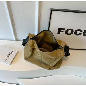 Macro view of khaki canvas messenger bag interior with large capacity and zipper