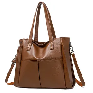 Sac fourre-tout en similicuir marron avec grandes poches avant et bandoulière amovible