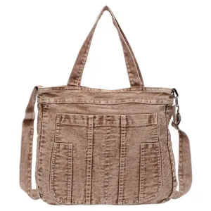 Retro washed brown denim tote bag with adjustable strap and utility pockets for casual wear