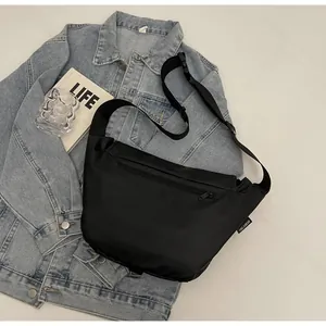 Detail of waterproof crossbody bag with back zipper pocket and adjustable strap