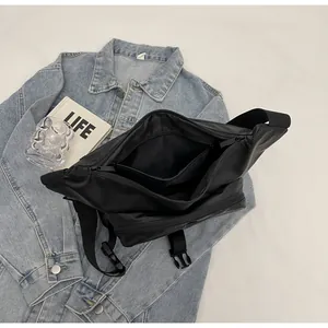 Detailed interior of the black waterproof sling bag showing spacious storage compartments