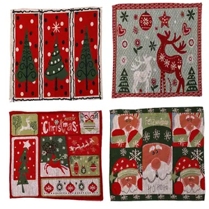 Set of four Christmas knitted placemats featuring Santa and Reindeer festive patterns