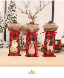 Detailed view of plaid Christmas wine bottle covers with Santa, Snowman and Reindeer embroidery