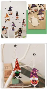 Detail of wooden Halloween gnome pendants with pumpkin and bat prints on a white tree