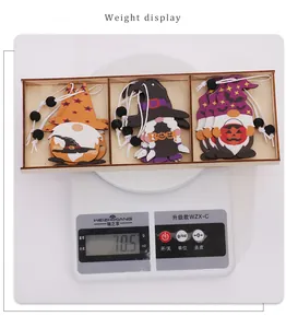 Weight display of Halloween wooden gnome ornaments in a wooden box on a scale