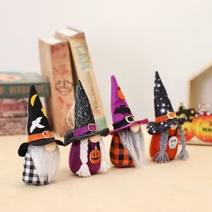 Set of four handmade Halloween gnomes with witch hats and pumpkins for festive decor