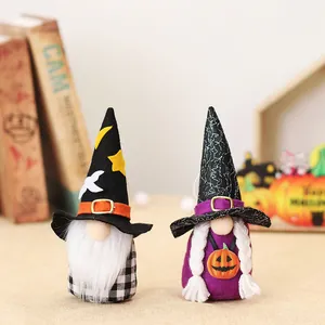 Pair of Halloween gnomes with wizard hats and pumpkin charms for festive table decor