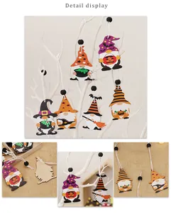 Detail display of Halloween gnome wood ornaments with pumpkin and bat motifs