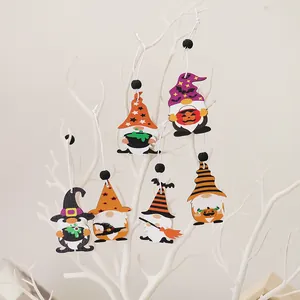 Set of 6 wooden Halloween gnome ornaments with witch hats and hanging strings on white branches