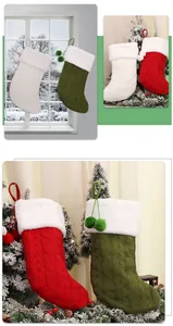 Detailed cable knit Christmas stockings with plush faux fur trim and pom-pom charms