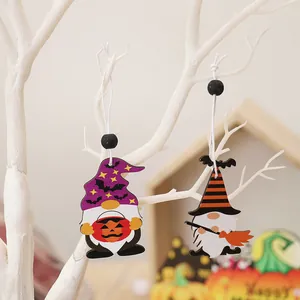 Halloween gnome wooden ornaments with pumpkin and broom on white decorative branches