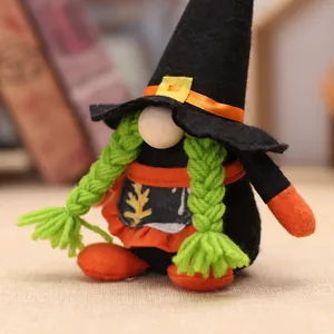 Halloween witch gnome plush with black hat, orange apron and green braids on warm background