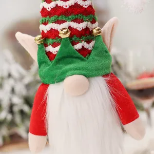 Christmas gnome wine bottle cover with red knitted hat and bells for festive table decor