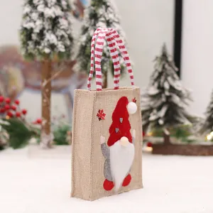 Christmas burlap gift bag with 3D gnome applique and red white striped handle