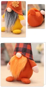 Detailed close-up of Thanksgiving gnomes featuring maple leaf accents and plaid hats