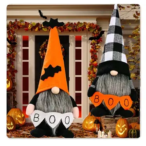 Close-up of Halloween gnome plush dolls holding BOO flags with bats and plaid hat details