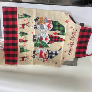 Christmas burlap apron with gnomes and Merry Christmas text for holiday kitchen decor