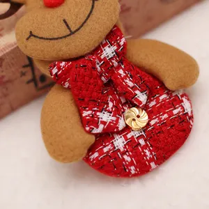 Christmas reindeer plush ornament with red plaid scarf and golden button detail