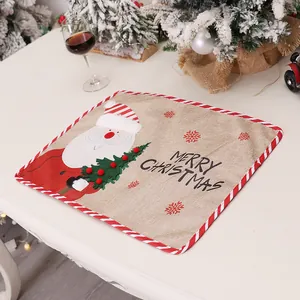 Christmas placemat with Santa embroidery, rustic linen texture and red striped edges